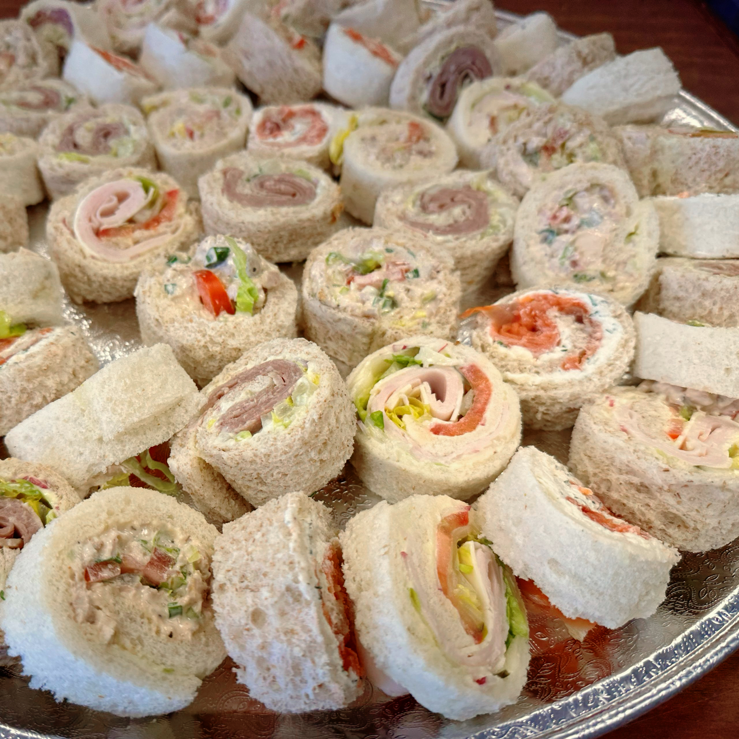 King Cole Catering, best wedding and corporate catering Winnipeg. fancy sandwich pinwheel sandwich funeral memorial